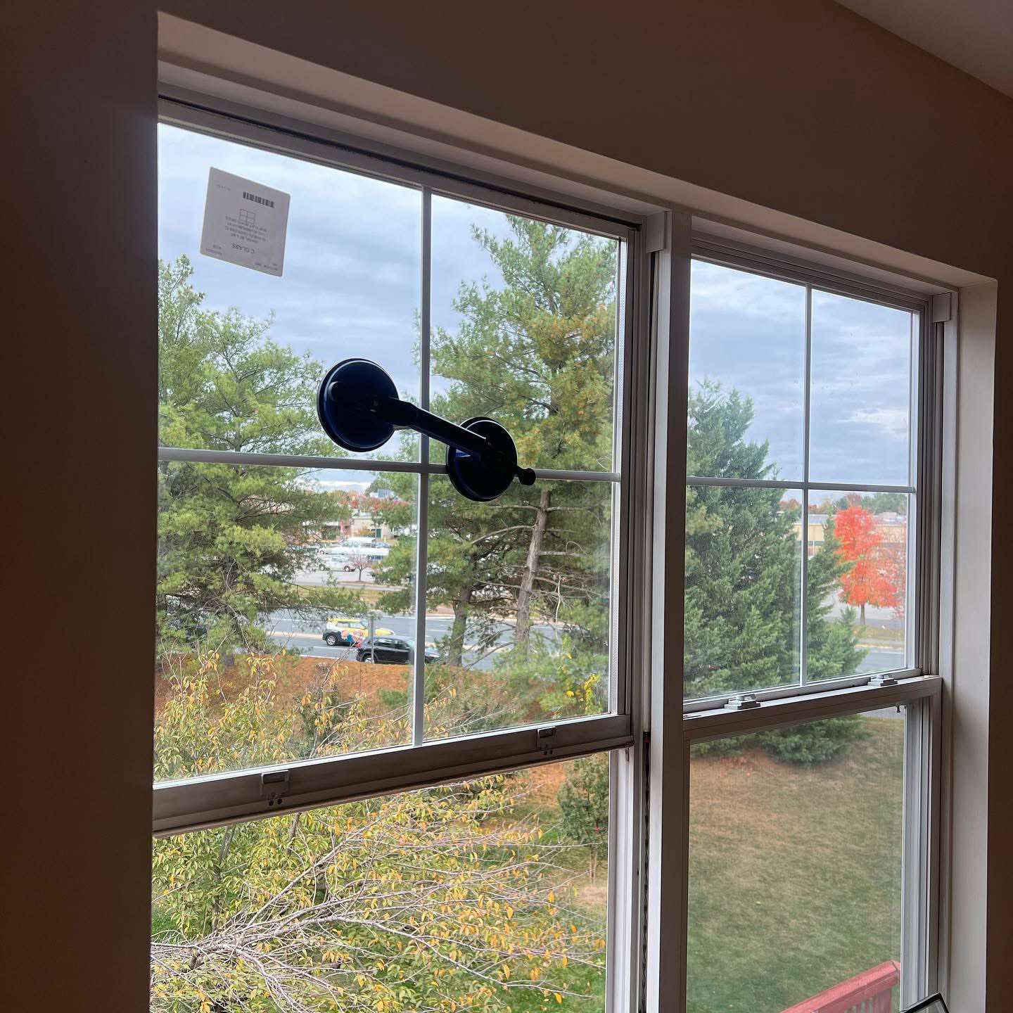 Commercial storefront glass door being installed by Apex technicians